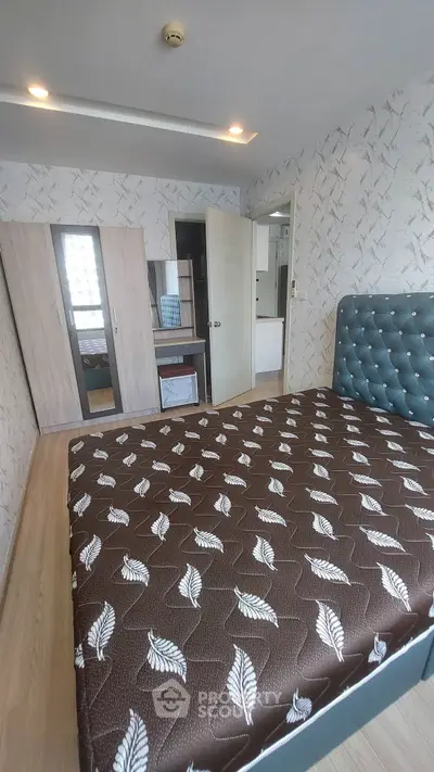 Modern bedroom with stylish decor and large wardrobe in a contemporary apartment.