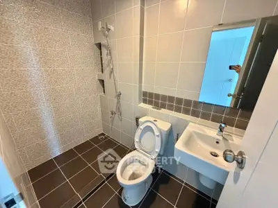 Modern bathroom with sleek tiles and contemporary fixtures