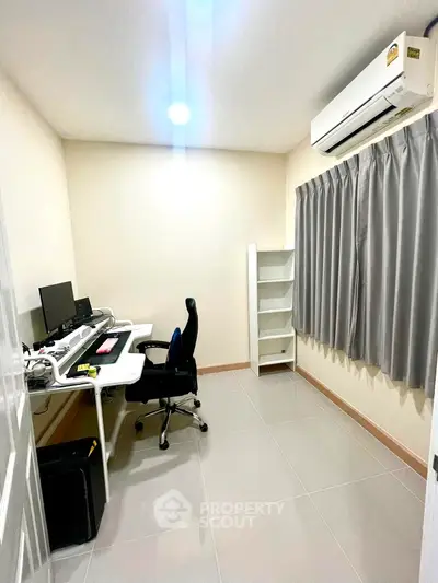 Modern study room with sleek desk, ergonomic chair, and air conditioning