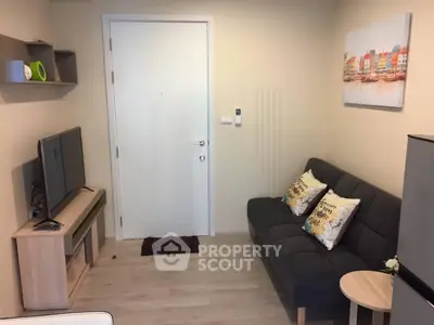 Cozy living room with modern decor and comfortable seating in a stylish apartment.