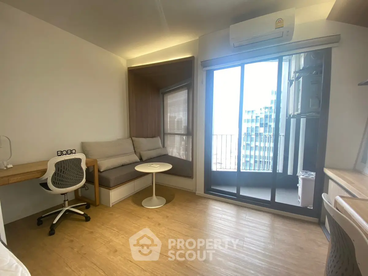 Modern living room with balcony view and stylish furniture