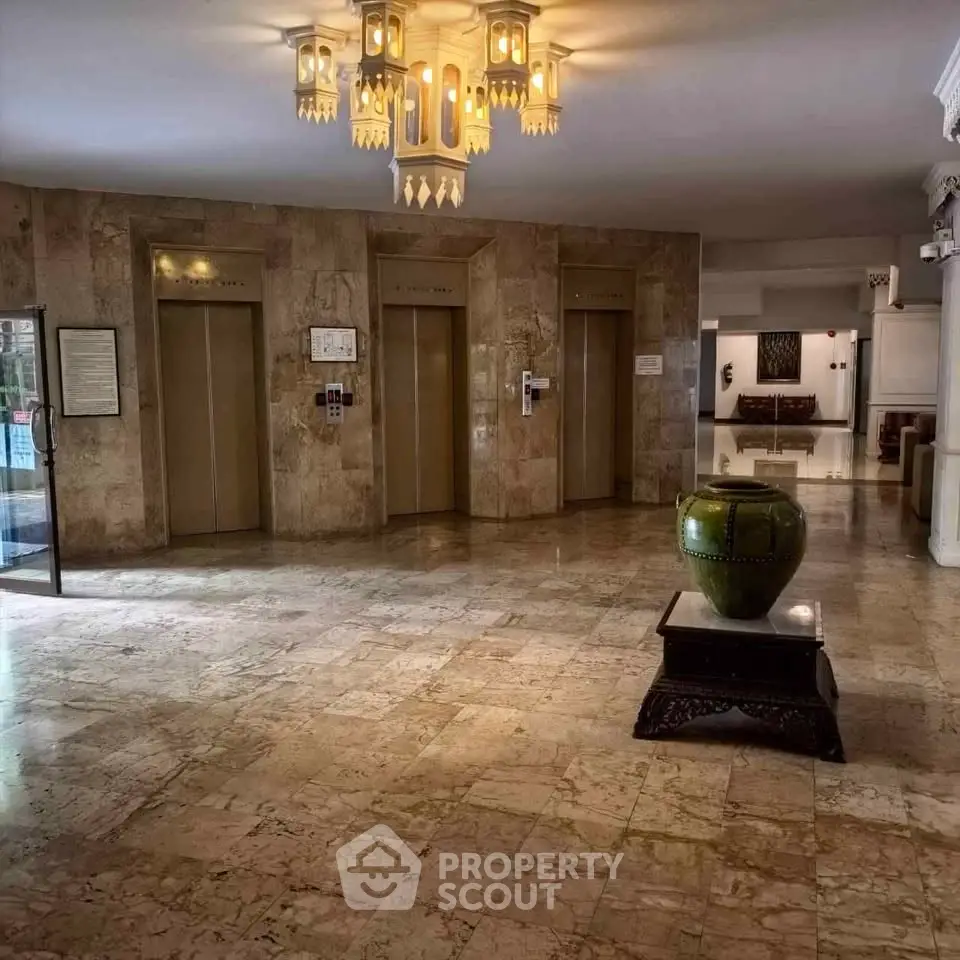 Elegant building lobby with marble floors and stylish lighting