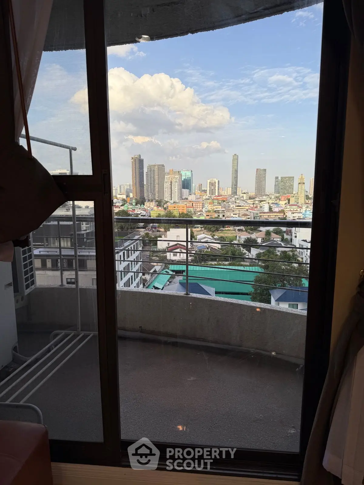 Stunning cityscape view from a high-rise balcony, perfect for urban living enthusiasts.