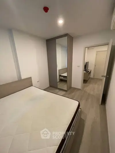 Modern bedroom with minimalist design and built-in wardrobe