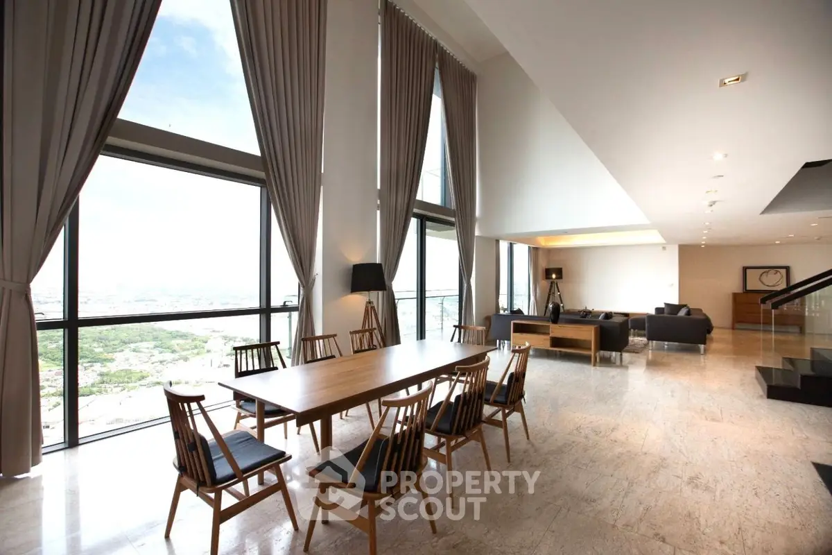 Luxurious high-ceiling living room with panoramic city views and elegant dining area.