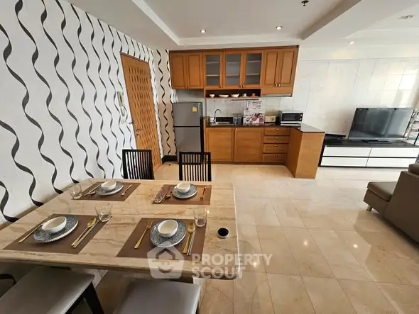 Spacious open-layout kitchen and dining area with modern appliances and stylish decor.