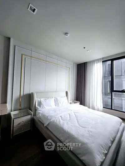 Elegant bedroom with modern design and large window for natural light