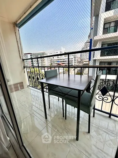 Charming balcony with city view, perfect for relaxing and enjoying the urban skyline.