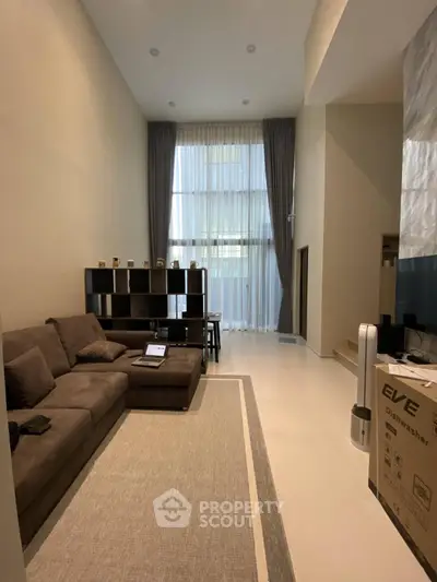 Spacious modern living room with high ceilings and elegant decor