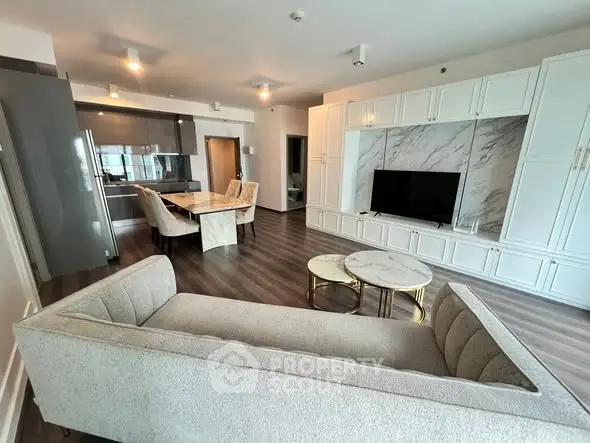 Luxurious open-plan living room with modern kitchen and elegant decor