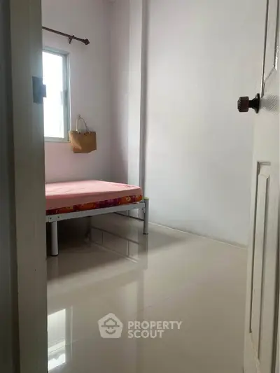 Cozy minimalist bedroom with natural light and simple decor