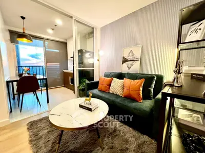 Stylish living room with modern decor and balcony view, perfect for urban living.