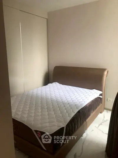 Cozy bedroom with modern bed and sleek closet design