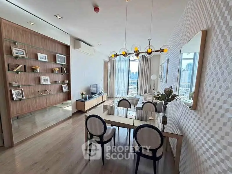 Modern living room with elegant dining area and city view, featuring stylish decor and ample natural light.