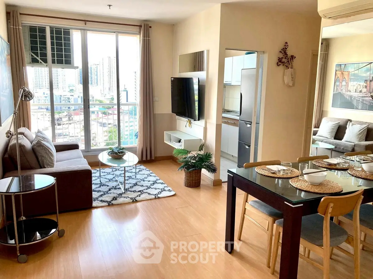 Spacious modern living room with dining area and city view, perfect for urban living.