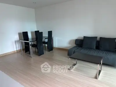 Modern living room with sleek furniture and wooden flooring