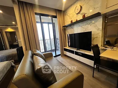 Modern living room with sleek furniture and balcony view