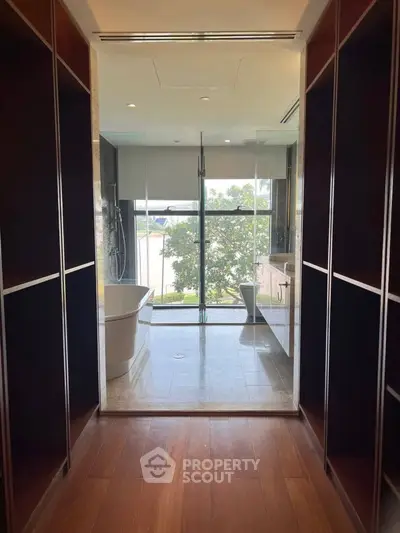 Luxurious bathroom with walk-in closet and stunning view