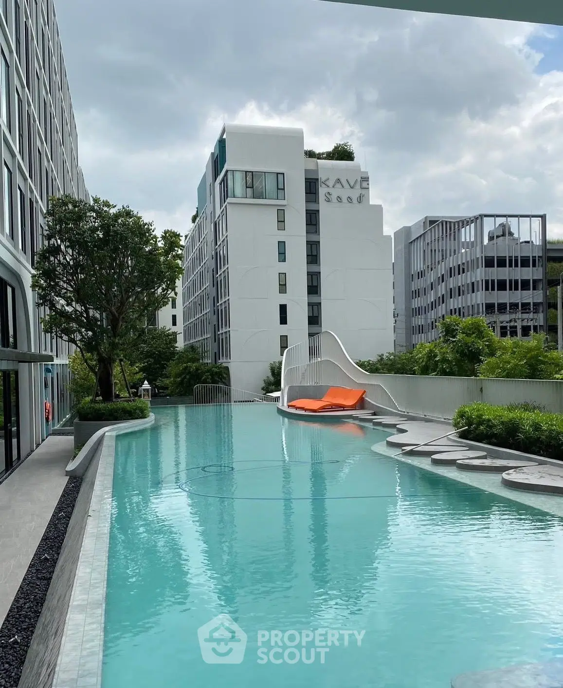 Luxurious apartment complex with stunning pool and modern architecture