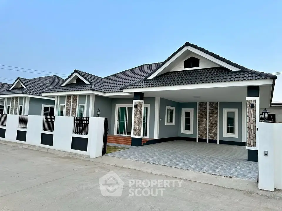 Modern single-story house with stylish facade and spacious driveway