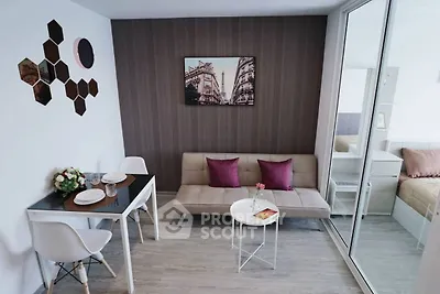 Modern living room with stylish decor and cozy seating area in a contemporary apartment.