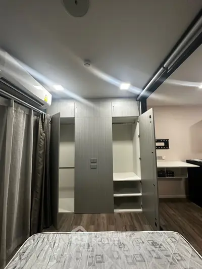 Modern bedroom with open wardrobe and stylish decor