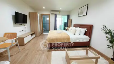Spacious modern bedroom with stylish decor and natural light