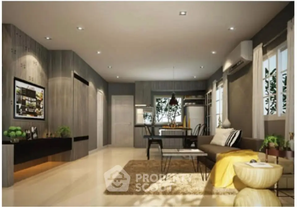 Modern living room with stylish decor and open layout, featuring a cozy seating area and dining space.