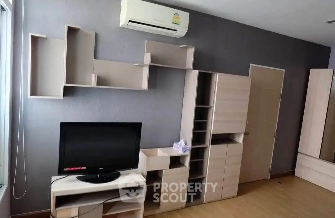 Modern living room with stylish shelving and air conditioning unit