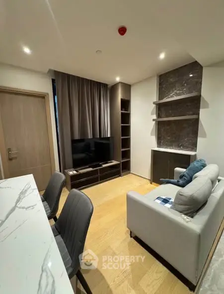 Modern living room with stylish furniture and marble accents