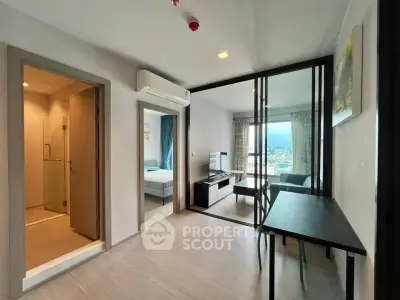Modern apartment interior with open living room and city view, featuring sleek design and natural light.