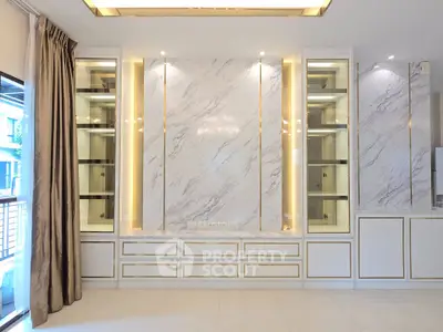 Luxurious living room with elegant marble wall and built-in cabinets