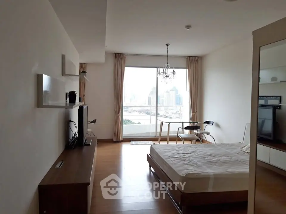 Spacious modern bedroom with city view and elegant furnishings