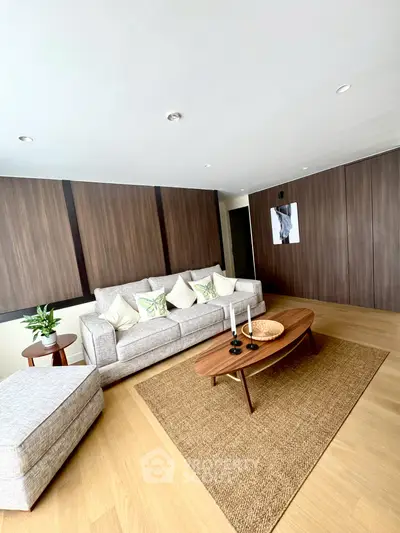 Spacious modern living room with elegant decor and wooden accents