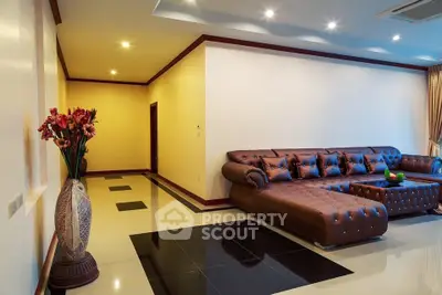 Luxurious living room with elegant leather sectional sofa and modern lighting