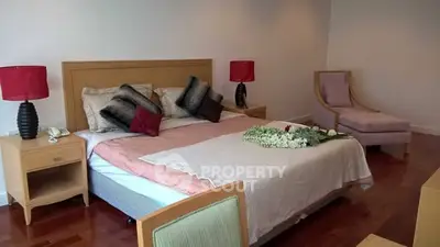 Elegant bedroom with stylish decor and cozy ambiance, featuring a comfortable bed and chic furnishings.