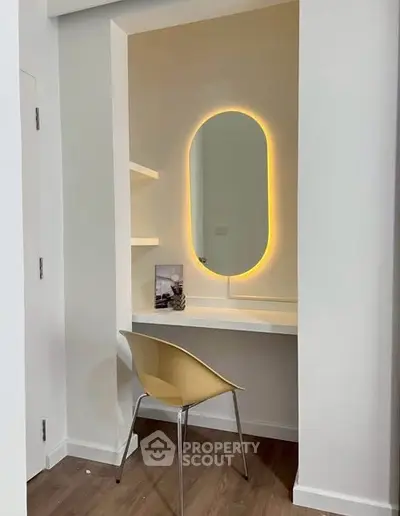 Modern study nook with illuminated mirror and sleek chair in minimalist design.