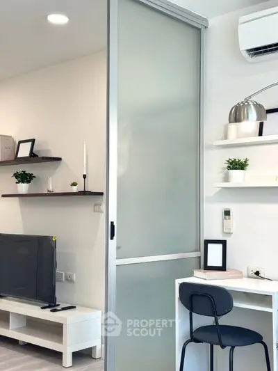 Modern living room with sleek sliding door and stylish decor