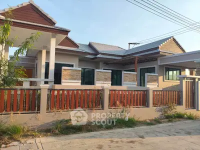 Charming single-story house with modern design and spacious front yard, perfect for family living.