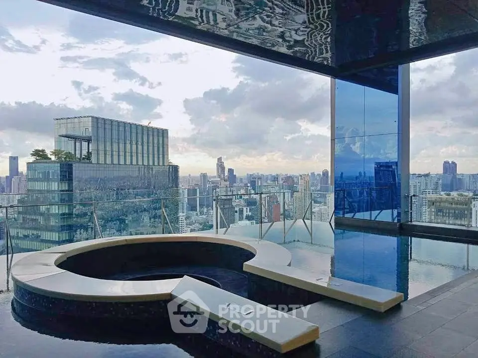 Luxurious rooftop pool with stunning city skyline view, perfect for urban living enthusiasts.