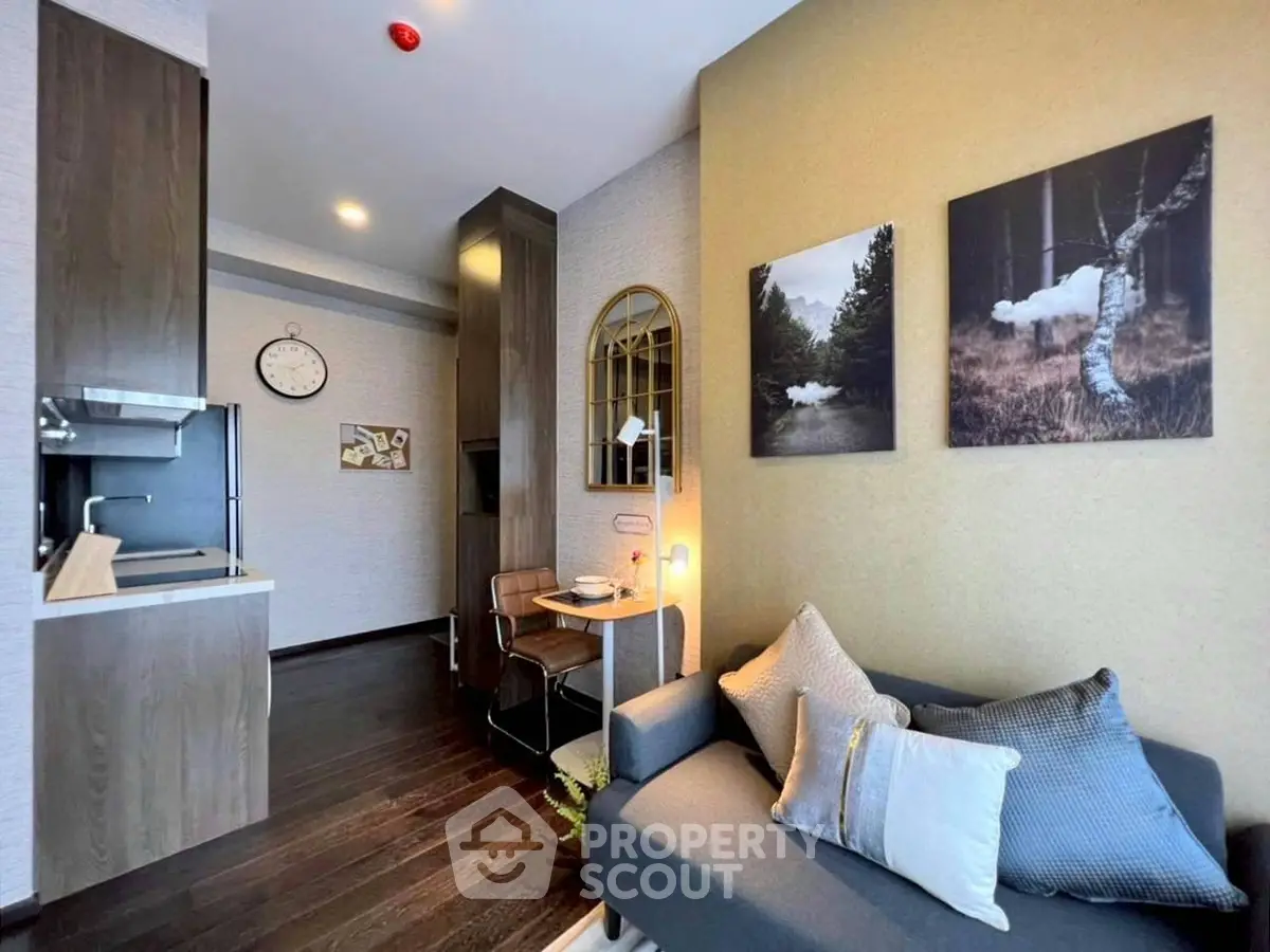 Modern living room with cozy sofa and stylish decor in open-plan apartment