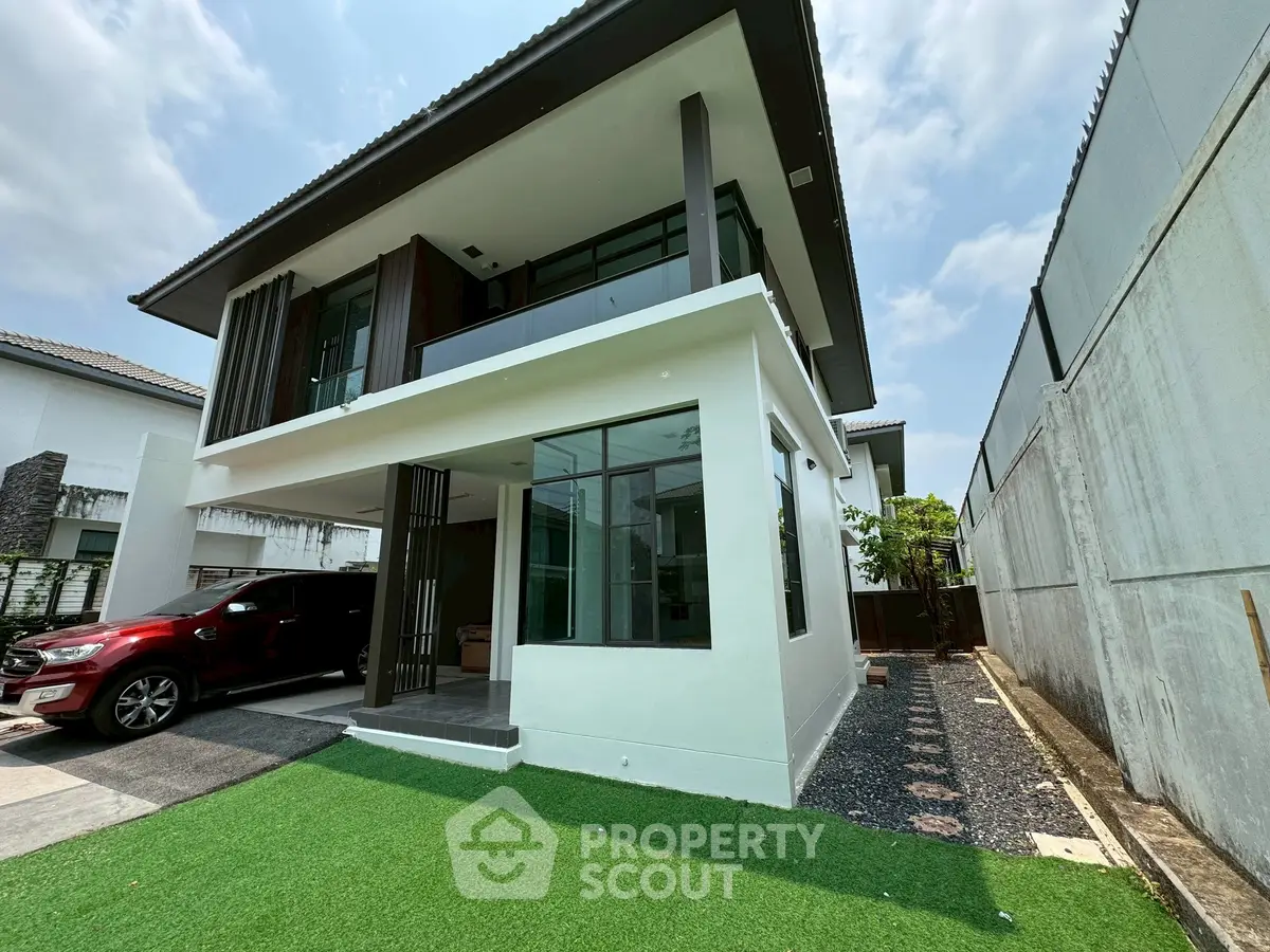 Modern two-story house with sleek design and spacious outdoor area