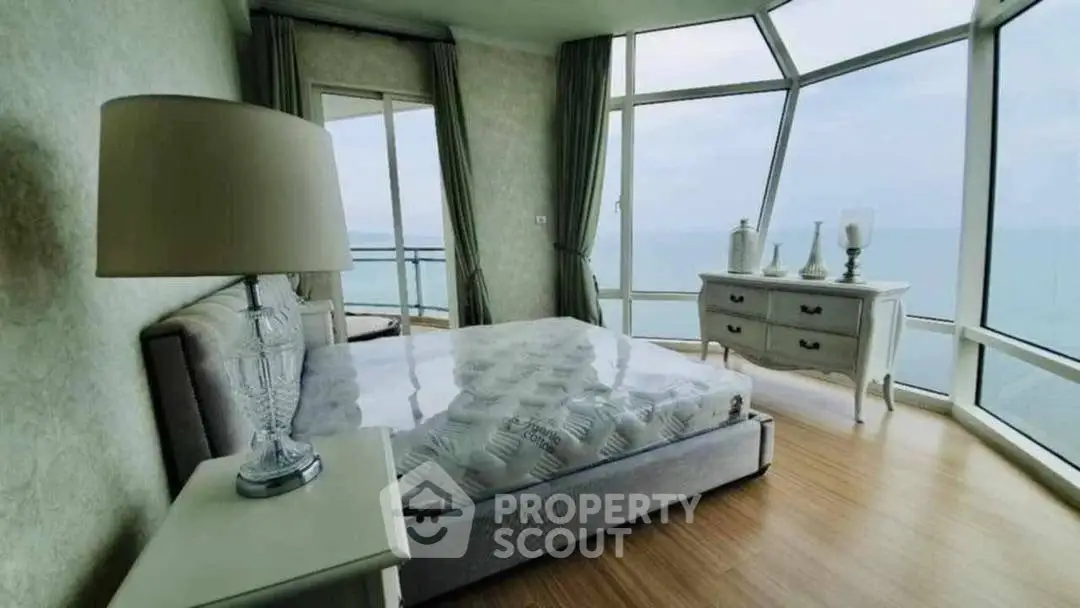 Luxurious bedroom with panoramic ocean view and elegant decor