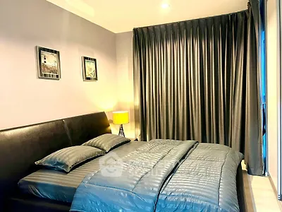 Cozy modern bedroom with elegant decor and soft lighting, perfect for relaxation.