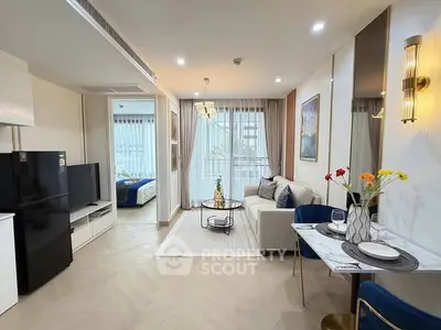 Modern open-plan living room with elegant decor and natural light