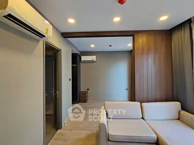 Modern living room with sleek design and air conditioning unit