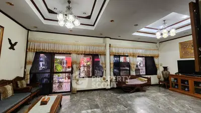 Spacious living room with elegant decor and large windows for natural light.