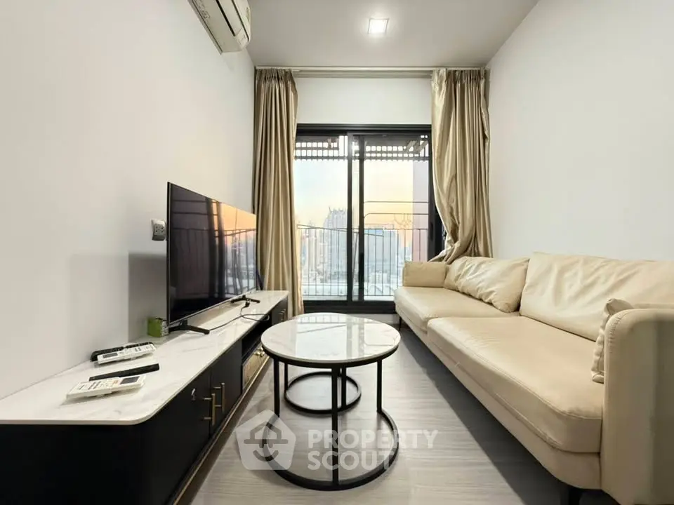 Modern living room with sleek furniture and city view balcony, perfect for urban living.