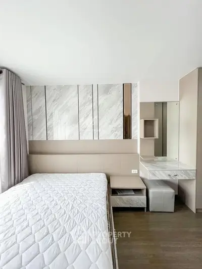 Modern bedroom with stylish decor and ample natural light