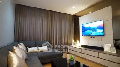 Modern living room with sleek design, cozy sectional sofa, and wall-mounted TV for ultimate comfort.